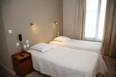 Un ou plusieurs lits dans un hébergement de l'établissement Hôtel La Pocatière