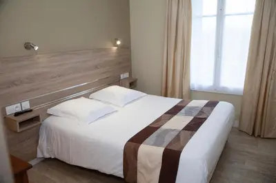 Un ou plusieurs lits dans un hébergement de l'établissement Hôtel La Pocatière