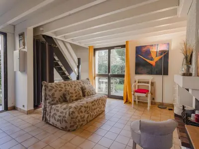 Coin salon dans l'établissement Holiday Home Le Clos du Golf-2 by Interhome