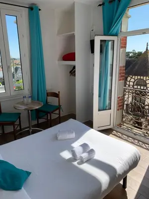 Un ou plusieurs lits dans un hébergement de l'établissement Hotel Le Cosy Riva Bella