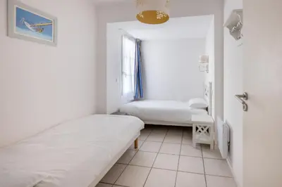 Un ou plusieurs lits dans un hébergement de l'établissement Résidence Odalys Le Domaine des Dunettes