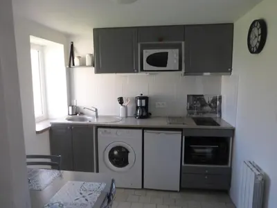 Cuisine ou kitchenette dans l'établissement Gite LA CHARRETTERIE
