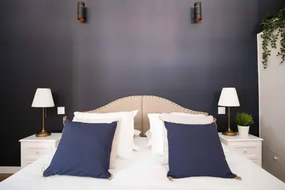 Un ou plusieurs lits dans un hébergement de l'établissement Elégant appartement en plein coeur de Cabourg - Les locations de Proust