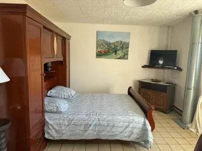 Un ou plusieurs lits dans un hébergement de l'établissement Appartement OMAHA BEACH