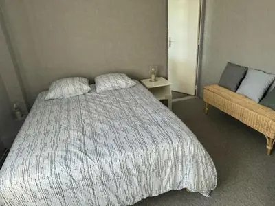 Un ou plusieurs lits dans un hébergement de l'établissement Appartement OMAHA BEACH
