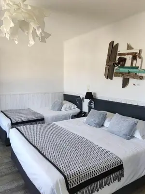 Un ou plusieurs lits dans un hébergement de l'établissement Le Relais des Iles