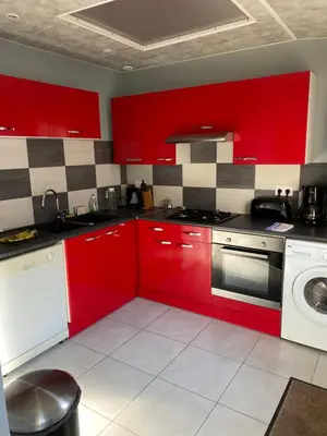 Cuisine ou kitchenette dans l'établissement Au Rythme des Vagues