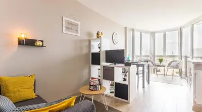 Télévision ou salle de divertissement dans l'établissement Bernières-sur-Mer Appartement chaleureux