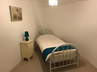 Un ou plusieurs lits dans un hébergement de l'établissement Orchid Cottage