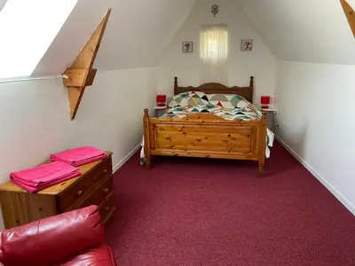 Un ou plusieurs lits dans un hébergement de l'établissement Rose Cottage