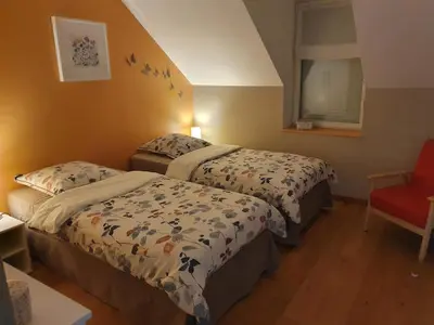 Un ou plusieurs lits dans un hébergement de l'établissement Gîte La Motte