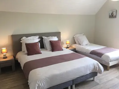 Un ou plusieurs lits dans un hébergement de l'établissement B&B de Saint Come de Fresné