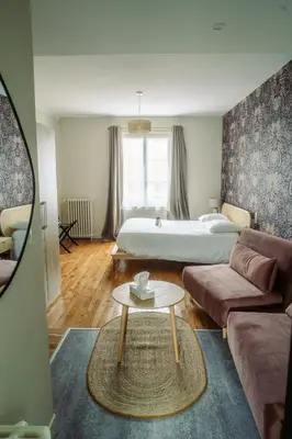 Un ou plusieurs lits dans un hébergement de l'établissement LOGIS -Hotel & Restaurant de la Place
