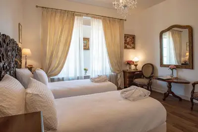 Un ou plusieurs lits dans un hébergement de l'établissement Maison d'hôtes de charme La Rose de Ducey près du Mont Saint Michel