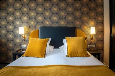 Un ou plusieurs lits dans un hébergement de l'établissement Best Western Plus Le Moderne