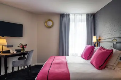 Un ou plusieurs lits dans un hébergement de l'établissement Best Western Plus Le Moderne