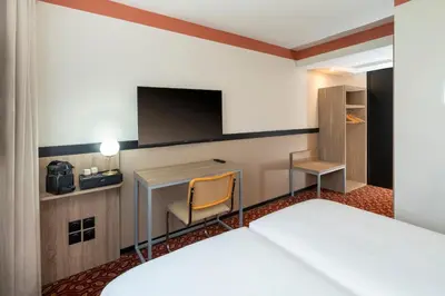 Un ou plusieurs lits dans un hébergement de l'établissement Sure Hotel by Best Western Caen Memorial