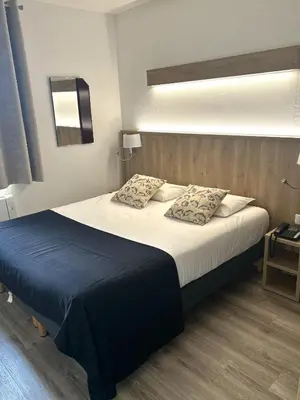 Un ou plusieurs lits dans un hébergement de l'établissement Contact Hotel Utah Beach Carentan