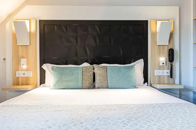 Un ou plusieurs lits dans un hébergement de l'établissement Best Western Le Moulin de Ducey