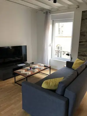 Télévision ou salle de divertissement dans l'établissement Le Duplex