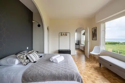 Un ou plusieurs lits dans un hébergement de l'établissement Le Sémaphore - Maison avec sauna vue mer