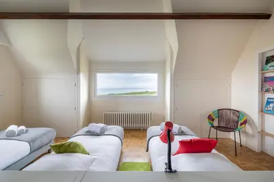 Un ou plusieurs lits dans un hébergement de l'établissement Le Sémaphore - Maison avec sauna vue mer