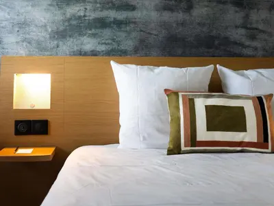 Un ou plusieurs lits dans un hébergement de l'établissement Novotel Bayeux