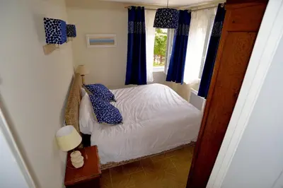 Un ou plusieurs lits dans un hébergement de l'établissement Villa Magulie, le calme en bord de plage