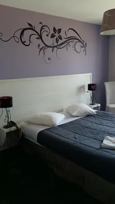 Un ou plusieurs lits dans un hébergement de l'établissement Hotel des Thermes et du Casino