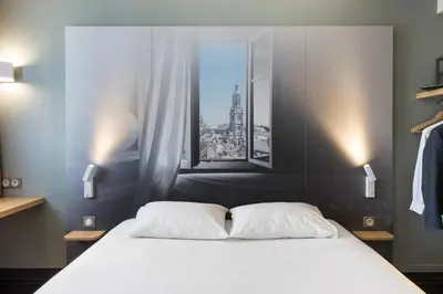 Un ou plusieurs lits dans un hébergement de l'établissement B&B HOTEL AVRANCHES Baie du Mont St-Michel