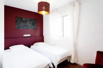 Un ou plusieurs lits dans un hébergement de l'établissement LUXE & VUE MER à Ouistreham Riva Bella, LUXURY & SEA VIEW