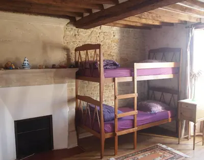 Un ou plusieurs lits dans un hébergement de l'établissement Chambres et Tables d'hôtes à l'Auberge Touristique