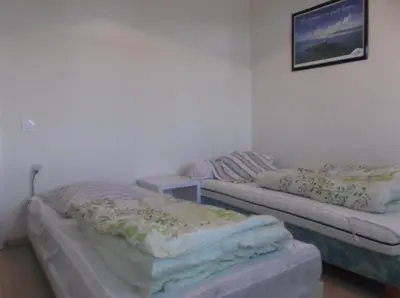 Un ou plusieurs lits dans un hébergement de l'établissement villa marine 2