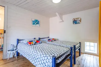 Un ou plusieurs lits dans un hébergement de l'établissement Cute Normandy Chaleureuse Maison au Cap Levi
