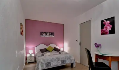 Un ou plusieurs lits dans un hébergement de l'établissement Chambres d'Hôtes Les Fleurettes en Baie Du Mont Saint Michel