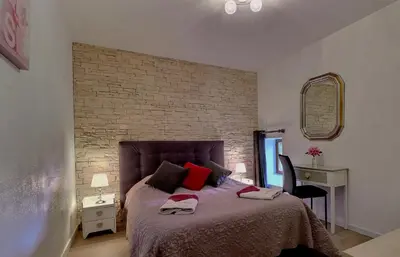 Un ou plusieurs lits dans un hébergement de l'établissement Chambres d'Hôtes Les Fleurettes en Baie Du Mont Saint Michel