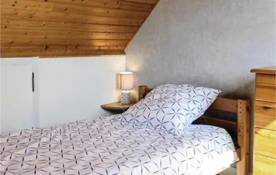 Un ou plusieurs lits dans un hébergement de l'établissement Awesome Home In Hauteville-Sur-Mer