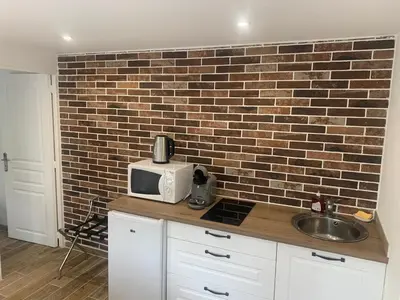 Cuisine ou kitchenette dans l'établissement Gîte centre ville avec cour