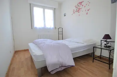 Un ou plusieurs lits dans un hébergement de l'établissement Appartement avec loggia - Proche centre et plage