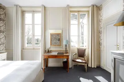 Un ou plusieurs lits dans un hébergement de l'établissement Chateau La Cheneviere