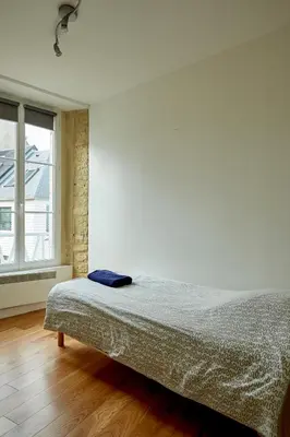 Un ou plusieurs lits dans un hébergement de l'établissement Appartement front mer proche omaha & utah beach - 1