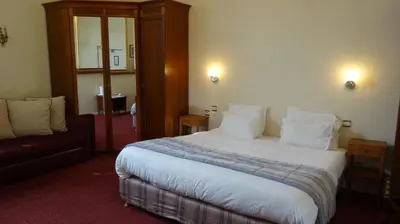 Un ou plusieurs lits dans un hébergement de l'établissement Best Western Hôtel Montgomery