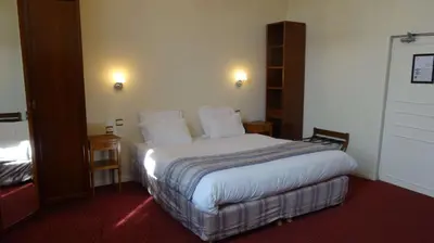 Un ou plusieurs lits dans un hébergement de l'établissement Best Western Hôtel Montgomery