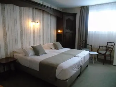 Un ou plusieurs lits dans un hébergement de l'établissement Best Western Hôtel Montgomery