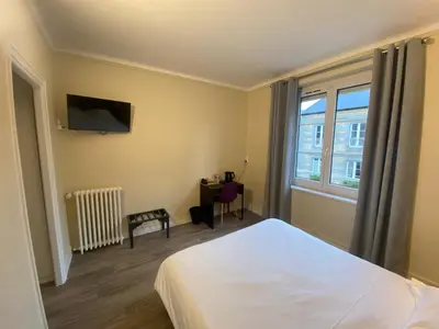Un ou plusieurs lits dans un hébergement de l'établissement Hotel De La Poste