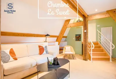 Coin salon dans l'établissement Sweet Home Cabourg Hôtel et gîtes