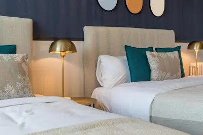 Un ou plusieurs lits dans un hébergement de l'établissement Hôtel restaurant l'Epicurien