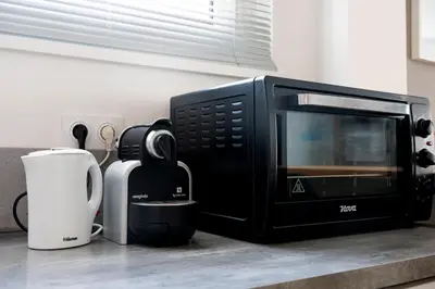 Cuisine ou kitchenette dans l'établissement Charmant appartement 4 personnes en centre-ville