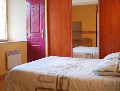 Un ou plusieurs lits dans un hébergement de l'établissement Le Manoir du Butel