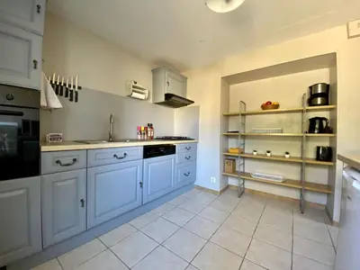 Cuisine ou kitchenette dans l'établissement La Camuche